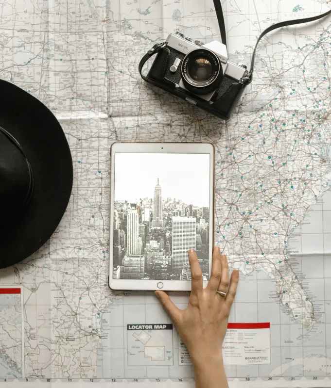 A map of America with a tablet on top showing new york